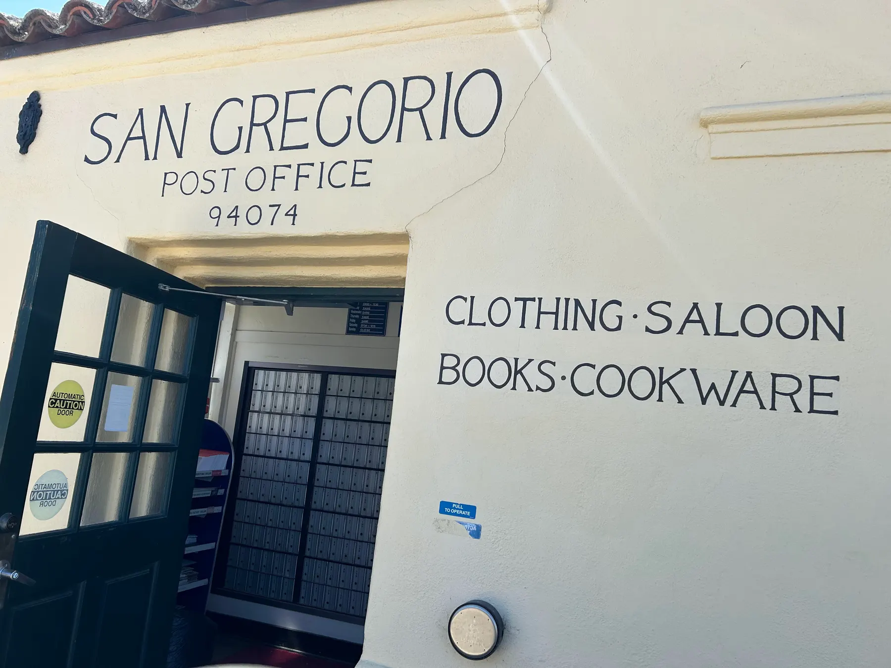 The white stucco San Gregorio Post Office and general store entrance